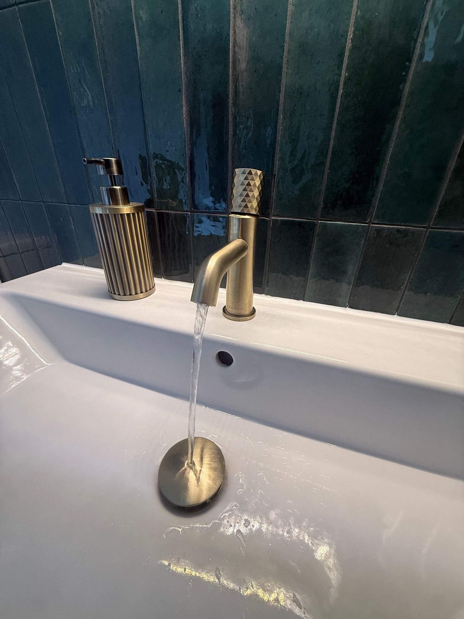Brushed brass basin mixer tap close-up