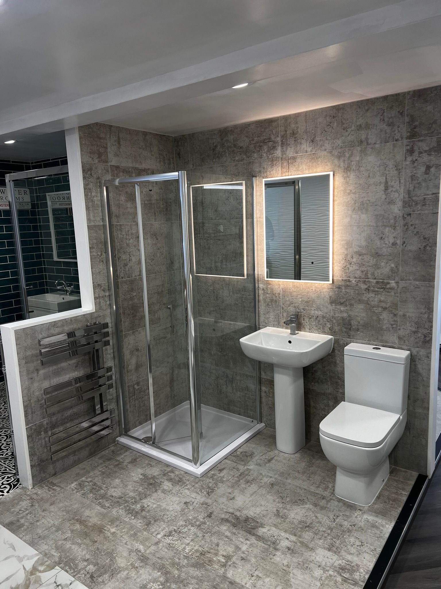 Grey bathroom with corner shower