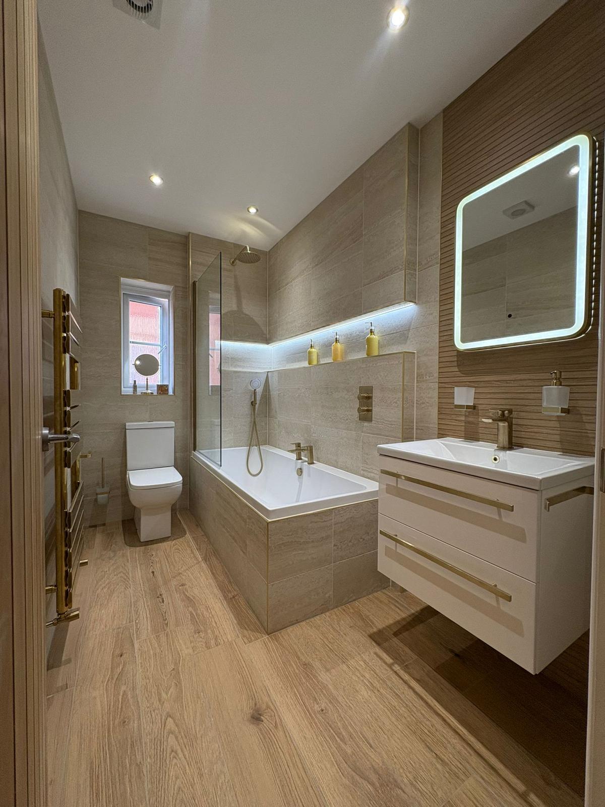 Wood panel bathroom suite with bath and shower